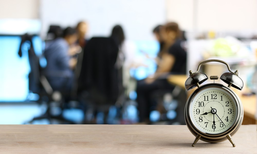 image of a clock in front of a blurry image