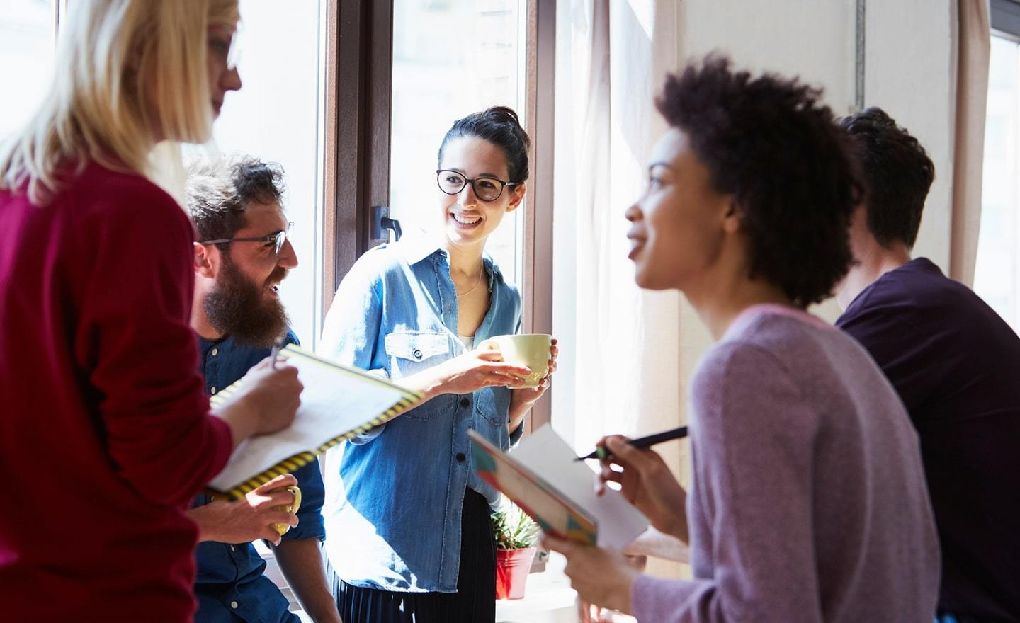 Group of coworkers standing and talking