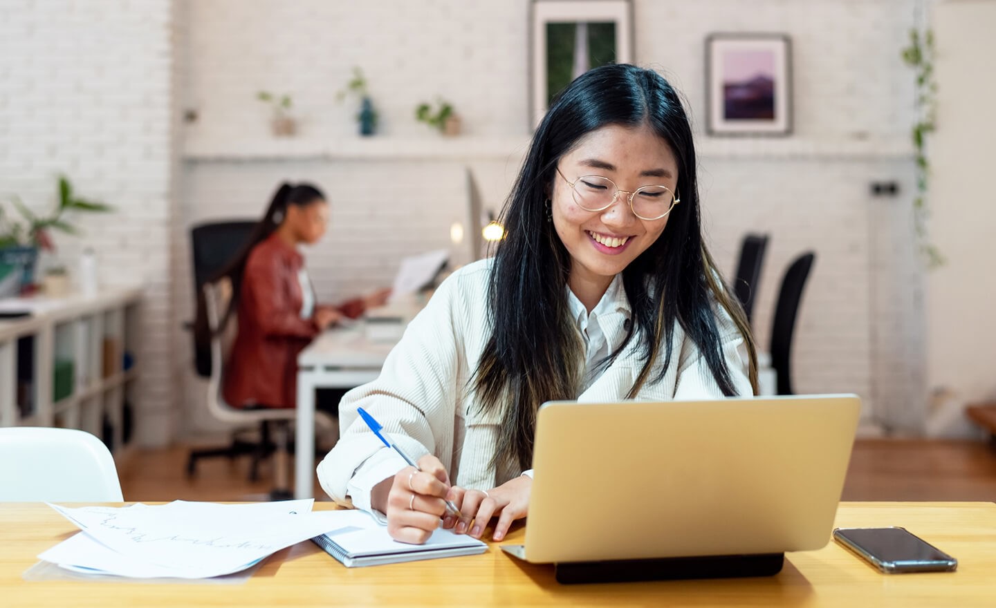 Happy woman working in office