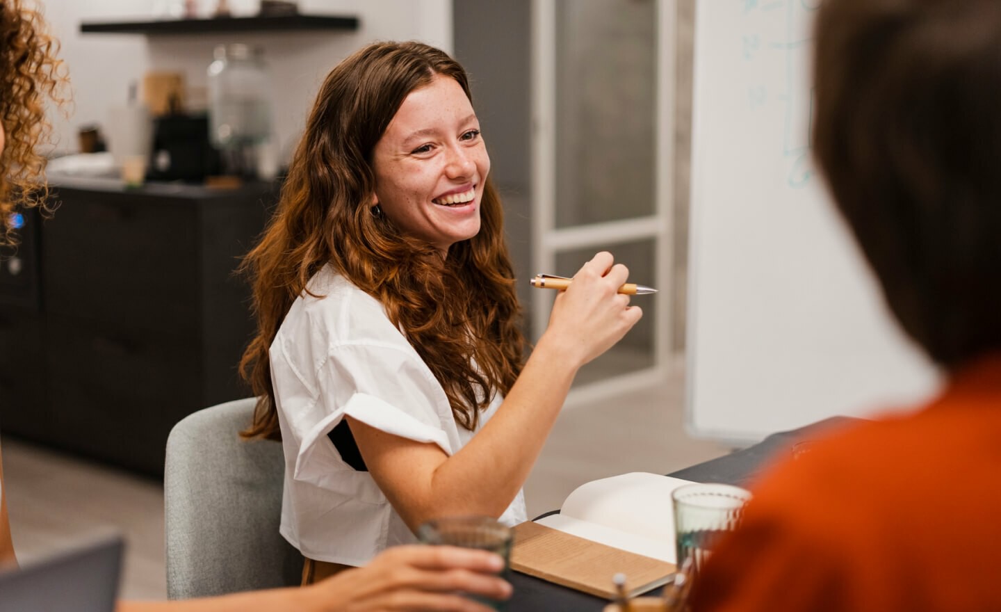 Person in meeting smiling 720x440