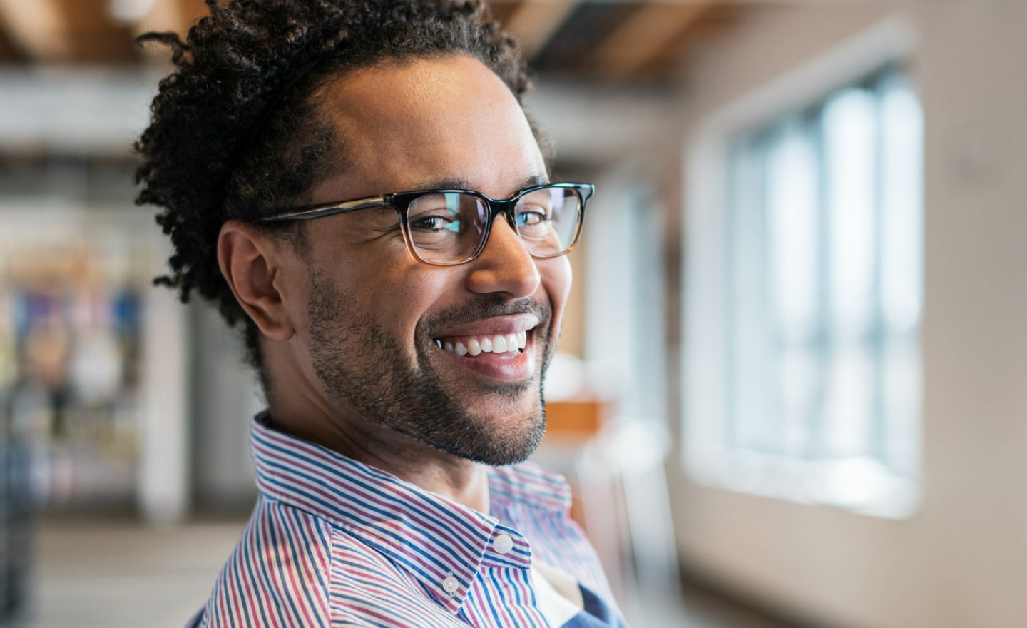 Smiling man with glasses