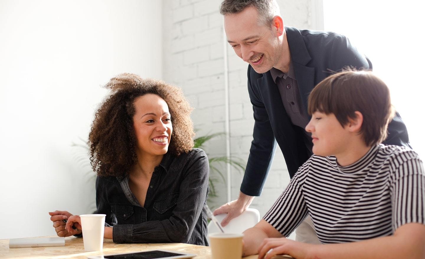 Three coworkers in a meeting