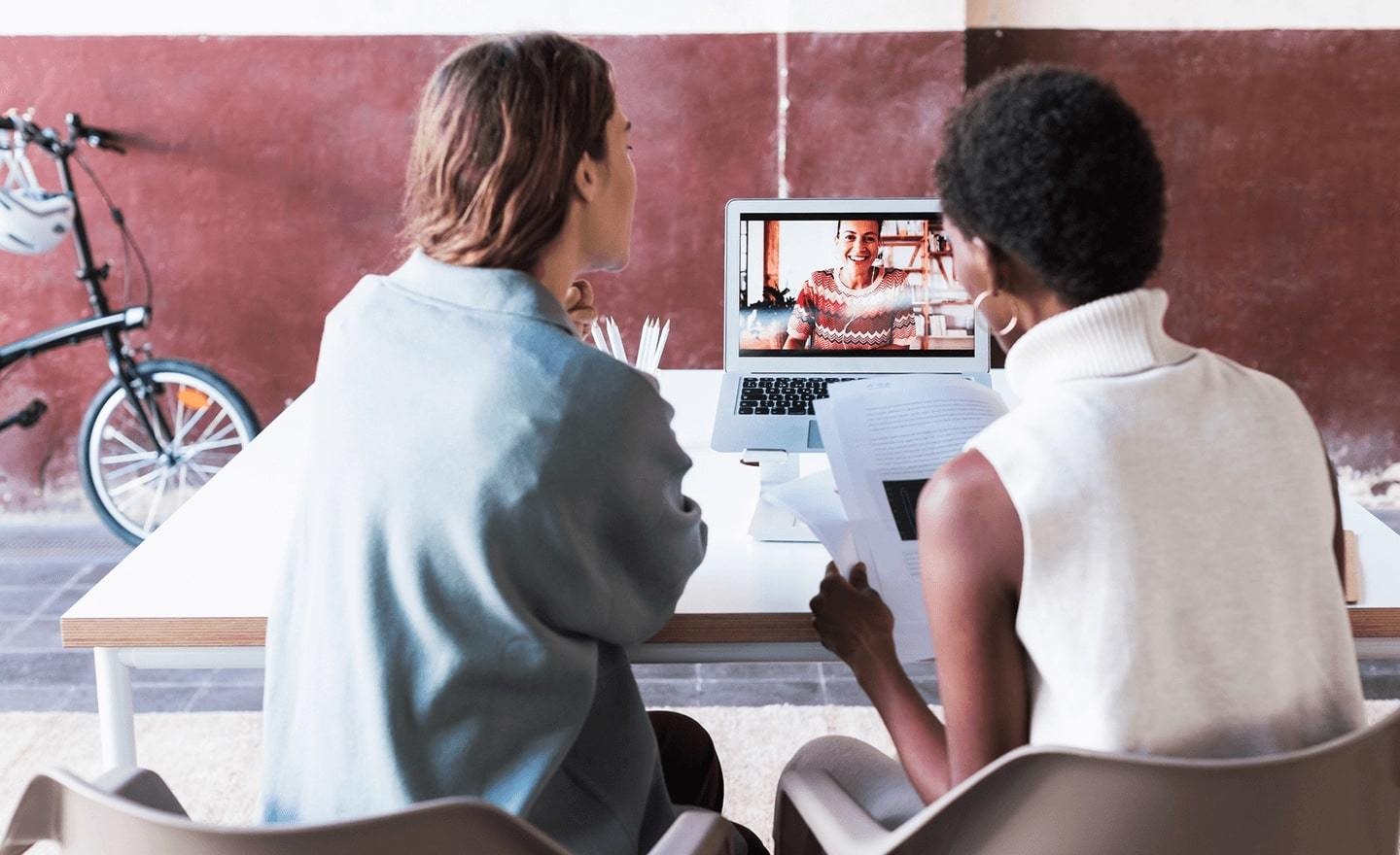 Three women video conferencing