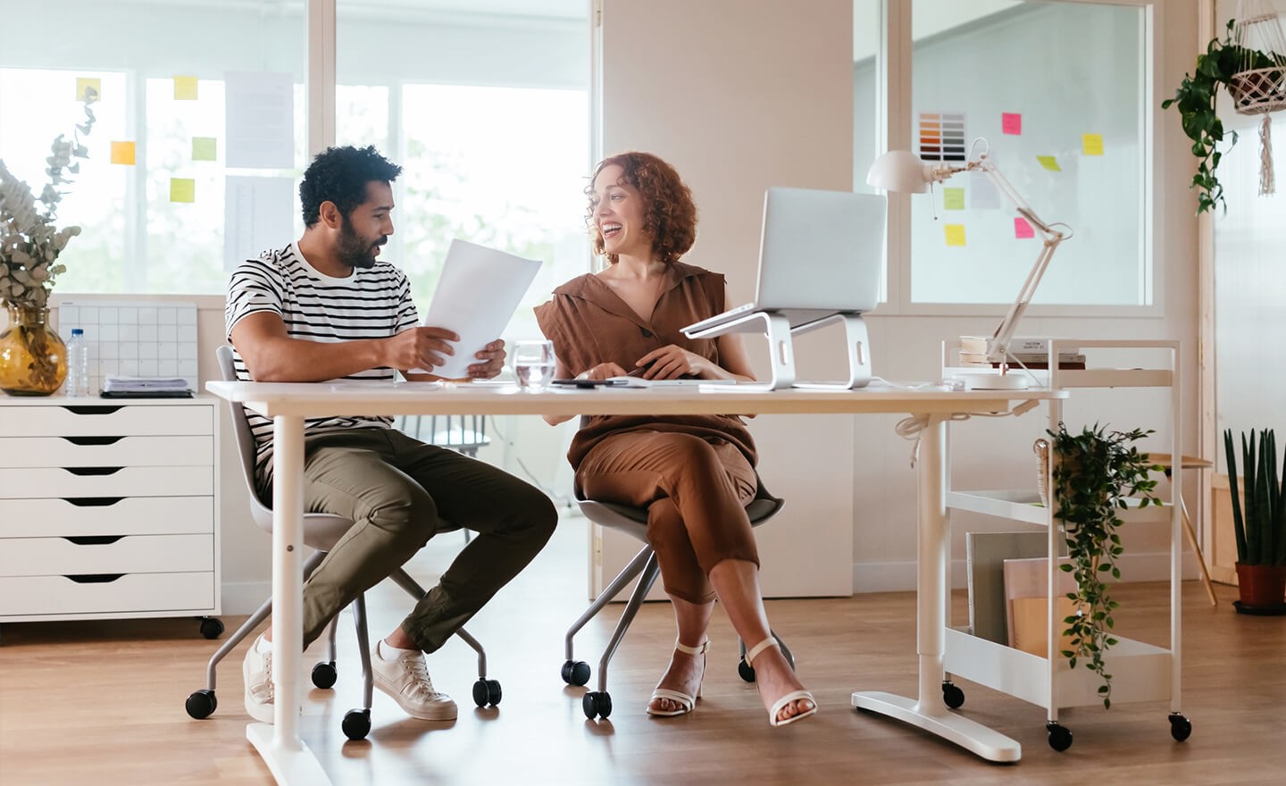 Two coworkers working together in office 1