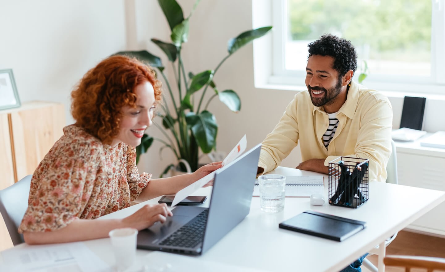 Two coworkers working together in office