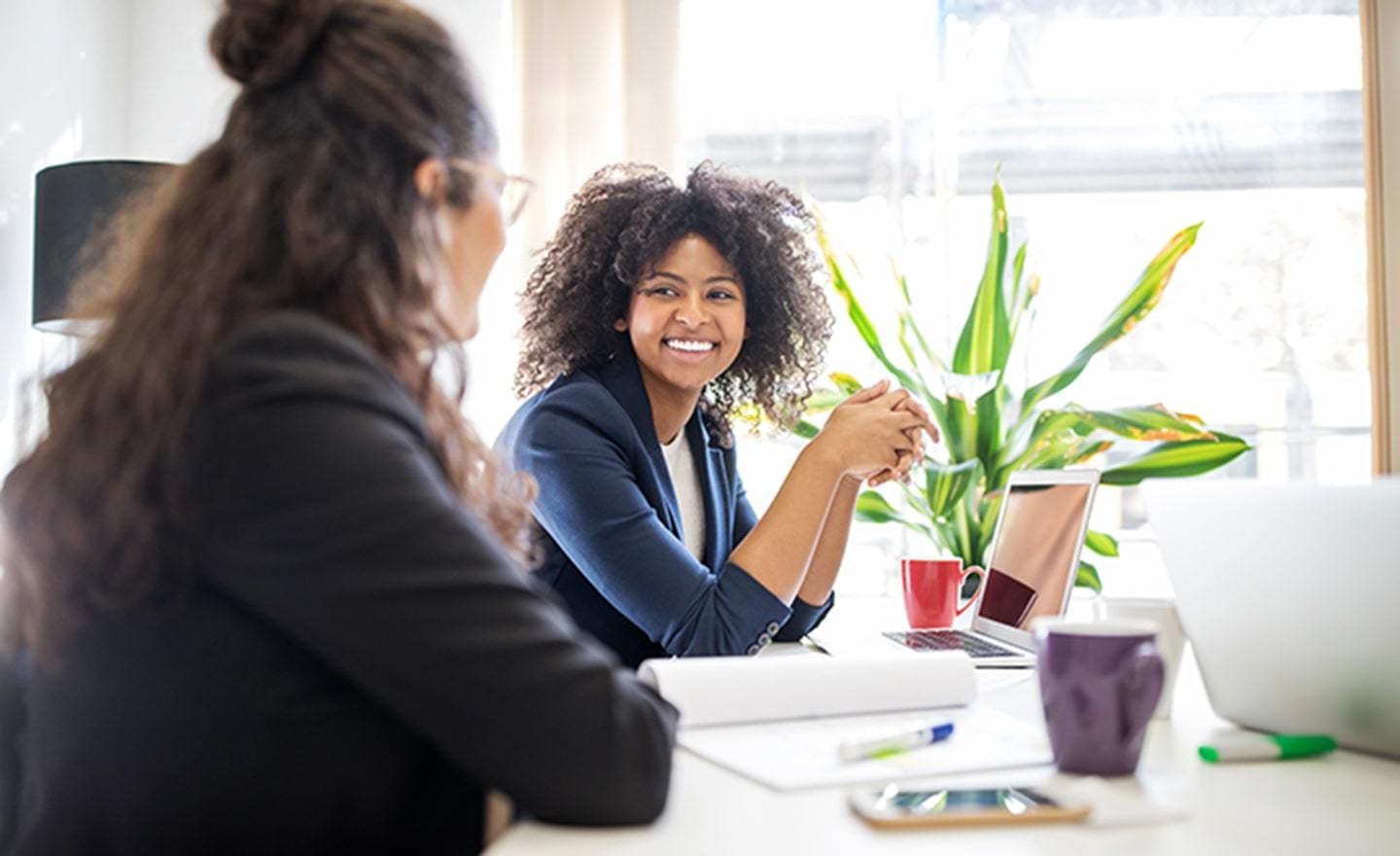 Two employees sitting business meeting office