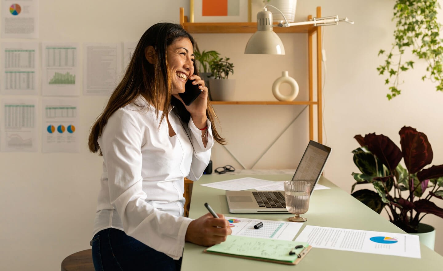 Woman looking at data on conference call