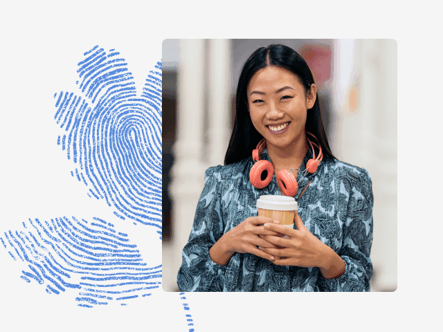 Photo of an Asian woman holding a coffee cup