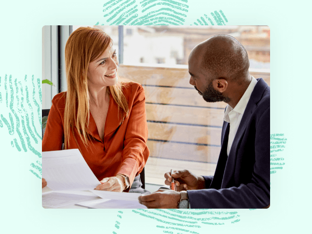 Woman and man discussing a document smiling resource 6